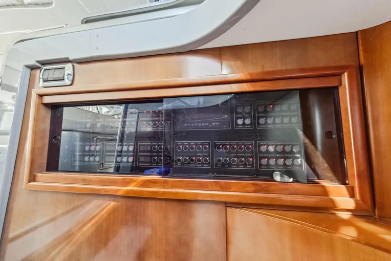 Slide: The Image of Control panel of a 2003 Baia PANTHER 80 yacht with wooden frame. - 38