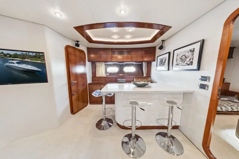 Slide: The Image of Luxurious interior of 2003 Baia Panther 80 yacht with modern bar and seating area. - 43
