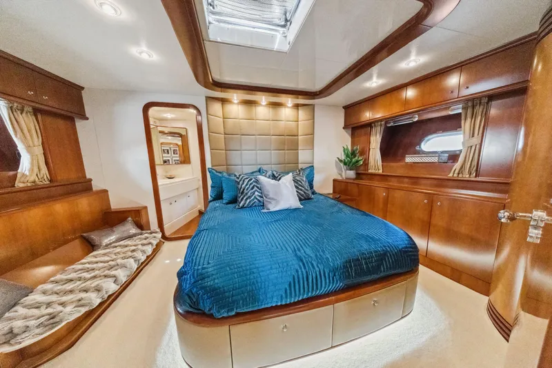 Slide: The Image of Luxurious cabin interior of 2003 Baia Panther 80 yacht with elegant wood finishes. - 47