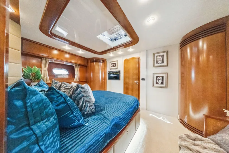 Slide: The Image of Luxurious cabin interior of 2003 Baia PANTHER 80 yacht with elegant wood finishes. - 49