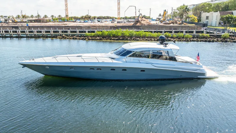 Slide: The Image of Luxury 2003 Baia Panther 80 yacht cruising on a calm waterway. - 7