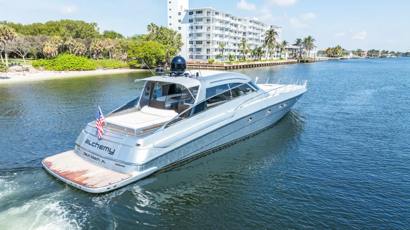 Slide: The Image of Luxury 2003 Baia Panther 80 yacht cruising on a scenic waterway. - 8