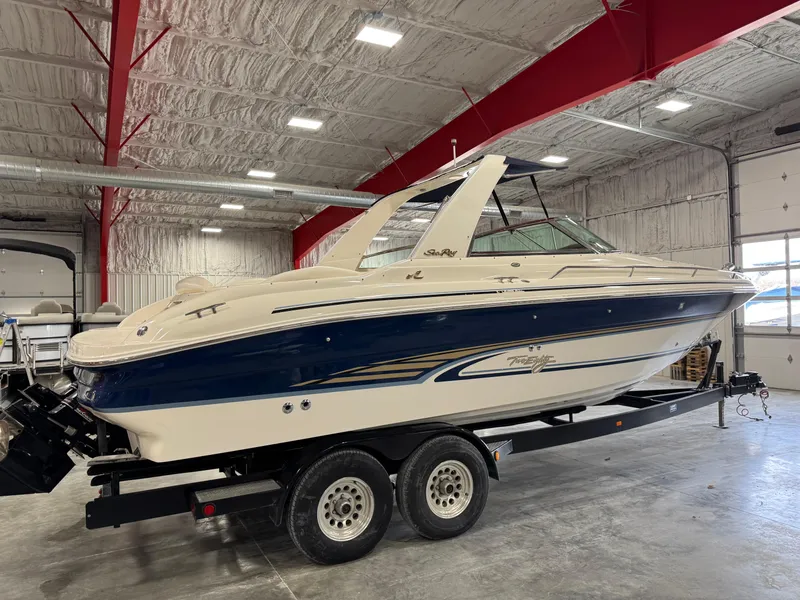 Slide: The Image of 2000 Sea Ray 280 BR boat on trailer in indoor storage facility. - 3
