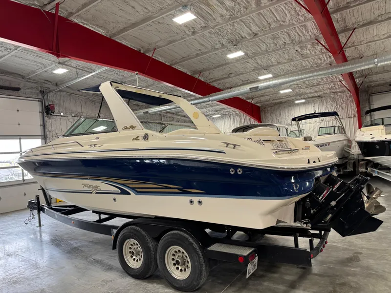 Slide: The Image of 2000 Sea Ray 280 BR boat on trailer in indoor storage facility. - 4