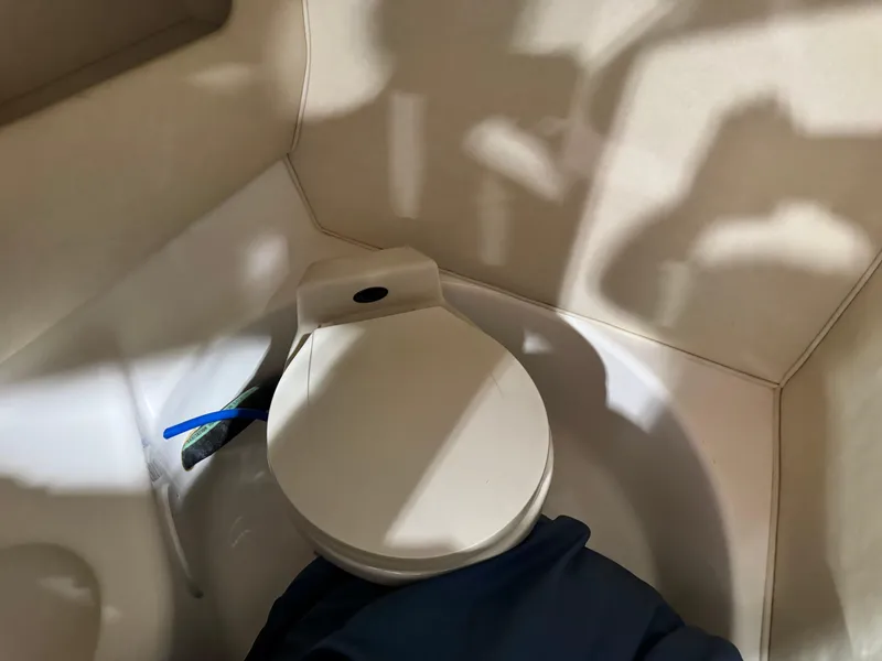 Slide: The Image of Toilet in 2000 Sea Ray 280 BR boat interior, compact and functional design. - 6