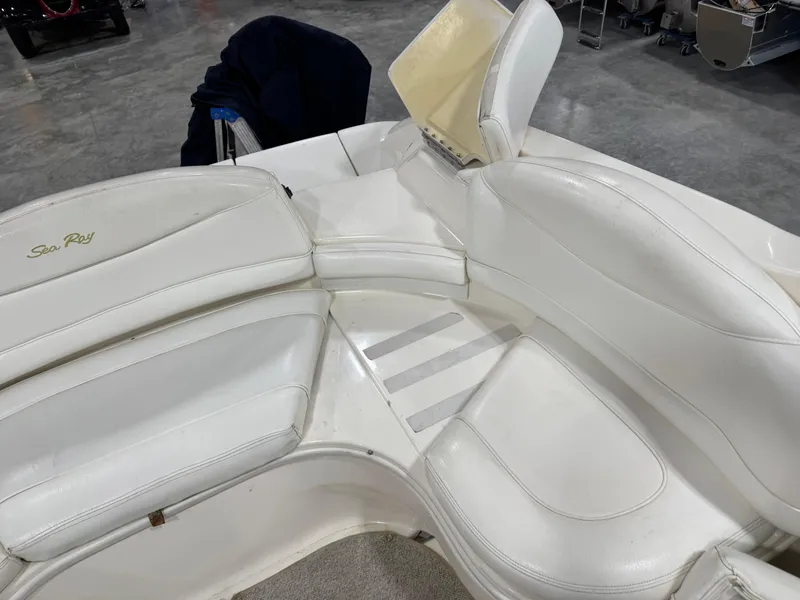 Slide: The Image of White leather seating on a 2000 Sea Ray 280 BR boat, showcasing spacious interior design. - 9