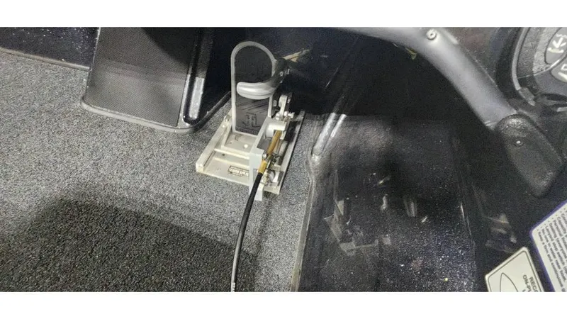 Slide: The Image of Foot pedal setup in a 2019 Nitro Z20 boat interior. - 10