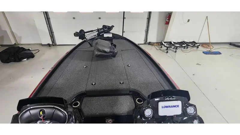 Slide: The Image of 2019 Nitro Z20 boat interior with Lowrance electronics in a garage setting. - 12