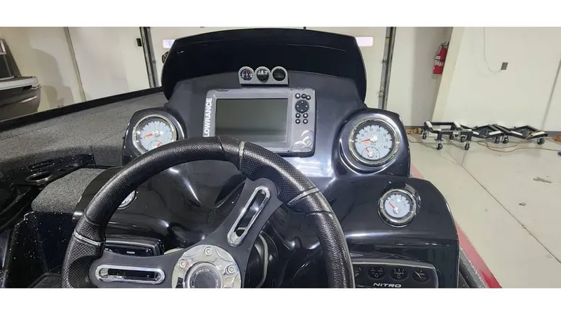 Slide: The Image of Steering console of a 2019 Nitro Z20 boat with gauges and navigation display. - 8