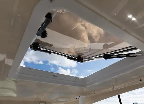 Slide: The Image of Open hatch on Solara S-250 DC boat, showcasing sky view, 2026 model. - 16