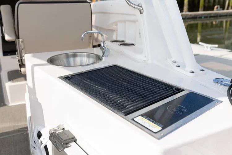 Slide: The Image of Outdoor kitchen on 2026 Solara S-250 DC boat with sink and grill. - 20