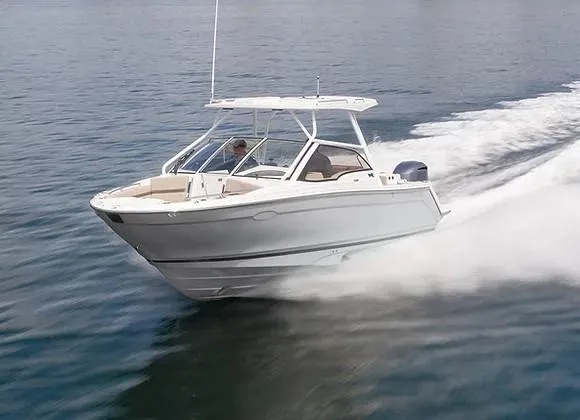 Slide: The Image of 2026 Solara S-250 DC boat cruising swiftly on open water. - 23