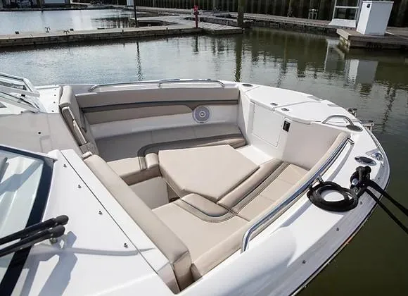 Slide: The Image of Luxurious seating area on 2026 Solara S-250 DC boat, docked by calm waters. - 3