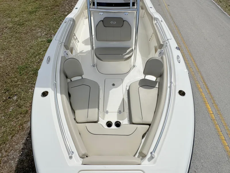 Slide: The Image of 2023 Key West 239 FS boat interior with cushioned seating and sleek design. - 10