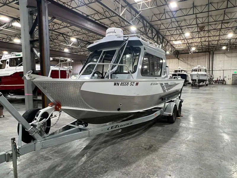 Slide: The Image of 2022 Hewescraft 210 Sea Runner ET HT boat on trailer in warehouse. - 10