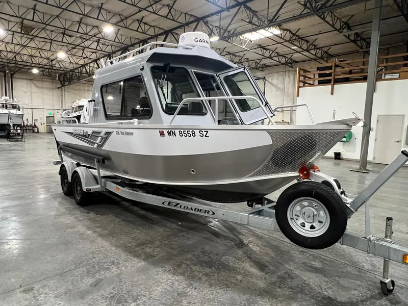 Slide: The Image of 2022 Hewescraft 210 Sea Runner ET HT boat on trailer in warehouse. - 11