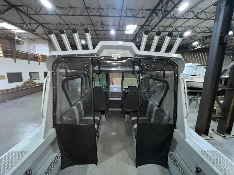 Slide: The Image of 2022 Hewescraft 210 Sea Runner ET HT boat interior with seating and rod holders. - 14