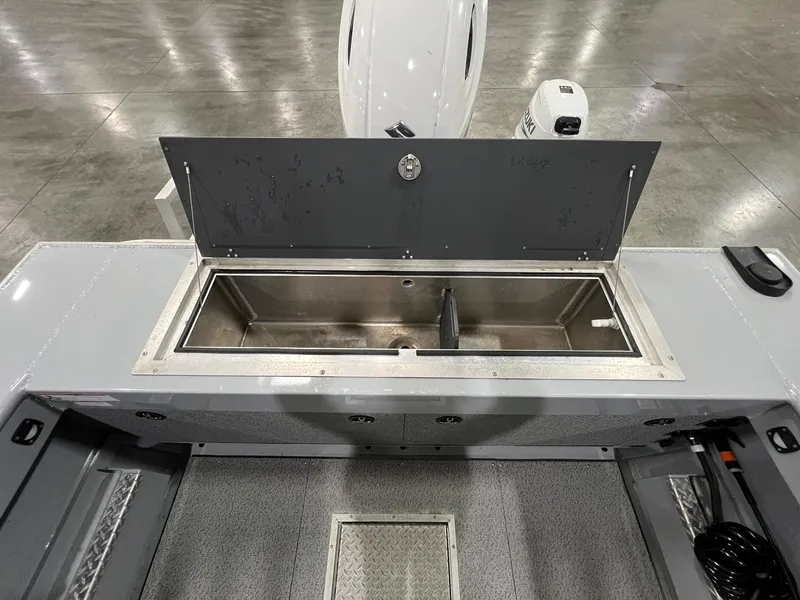 Slide: The Image of 2022 Hewescraft 210 Sea Runner ET HT boat interior with open storage compartment. - 16