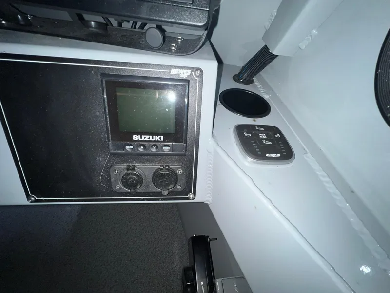 Slide: The Image of Control panel of 2022 Hewescraft 210 Sea Runner ET HT boat interior. - 22