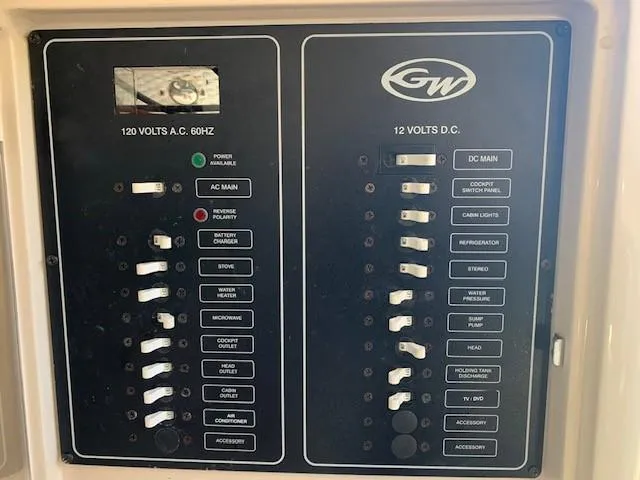 Slide: The Image of Electrical panel of 2006 Grady-White Marlin 300 boat with AC and DC switches. - 14