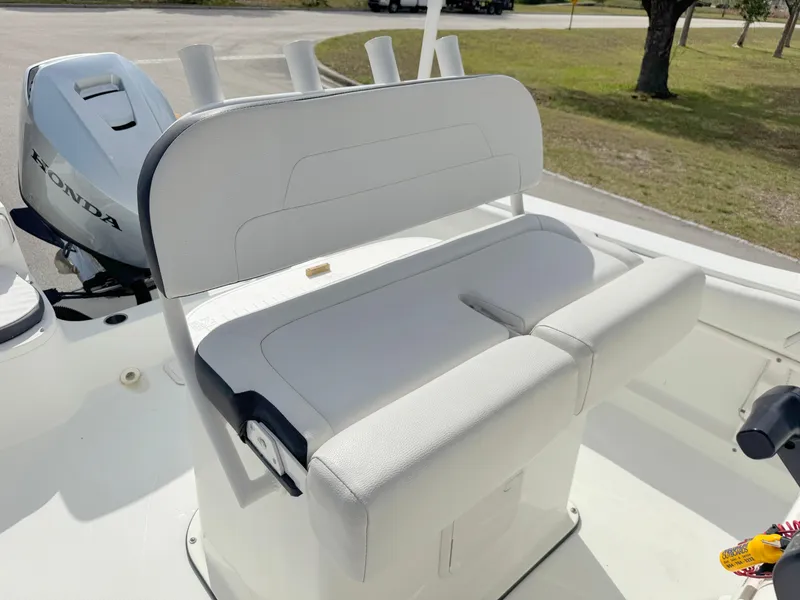 Slide: The Image of Clearwater 2200 WI Center Console 2016 boat with Honda engine, featuring white seating. - 15