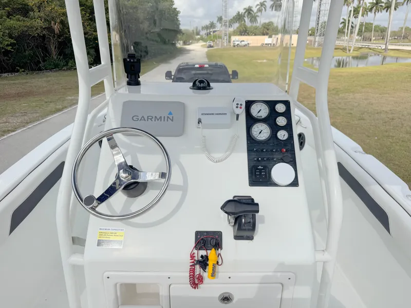 Slide: The Image of 2016 Clearwater 2200 WI Center Console boat dashboard with Garmin navigation system. - 16