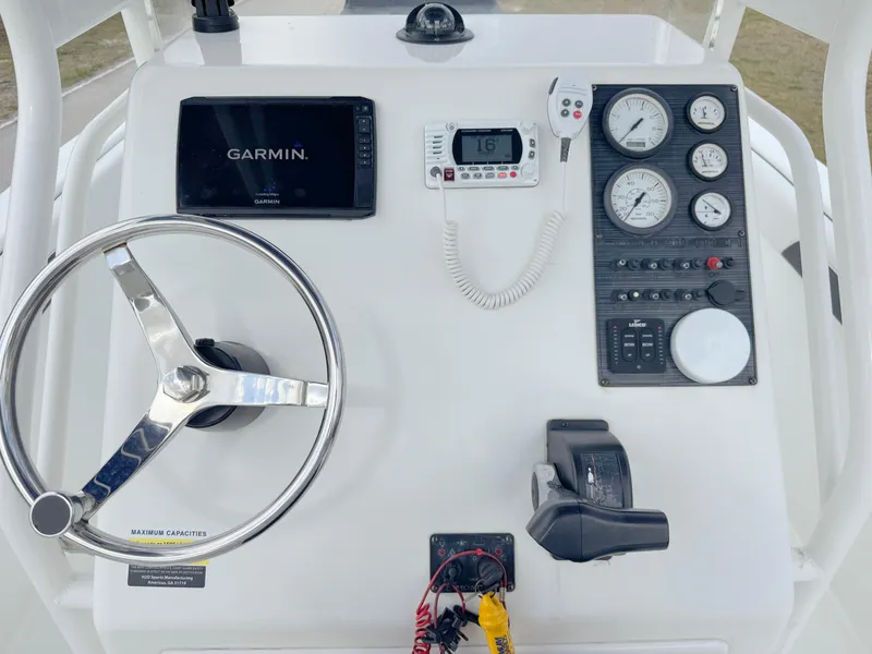 Slide: The Image of Center console of 2016 Clearwater 2200 WI boat with Garmin navigation system. - 17