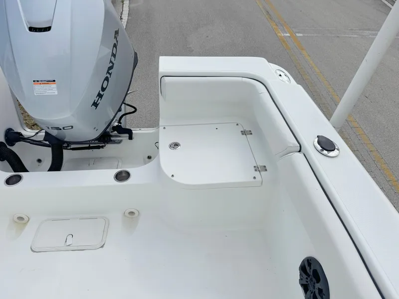 Slide: The Image of 2016 Clearwater 2200 WI Center Console boat with Honda outboard motor, rear deck view. - 22