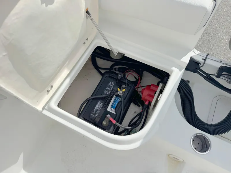 Slide: The Image of Battery compartment of 2016 Clearwater 2200 WI Center Console boat, showing wiring and connections. - 23