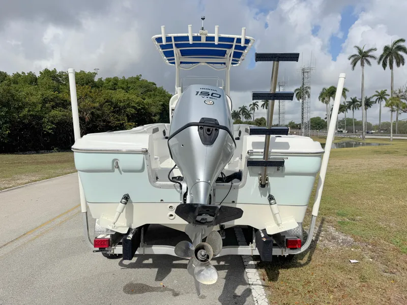 Slide: The Image of 2016 Clearwater 2200 WI Center Console boat with Yamaha 150 engine, parked outdoors. - 3