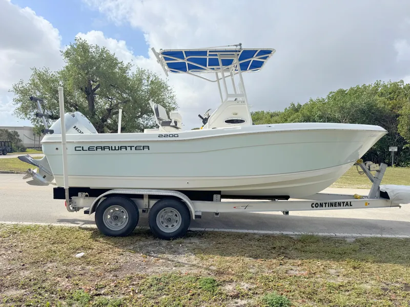 Slide: The Image of 2016 Clearwater 2200 WI Center Console boat on trailer, parked outdoors. - 5