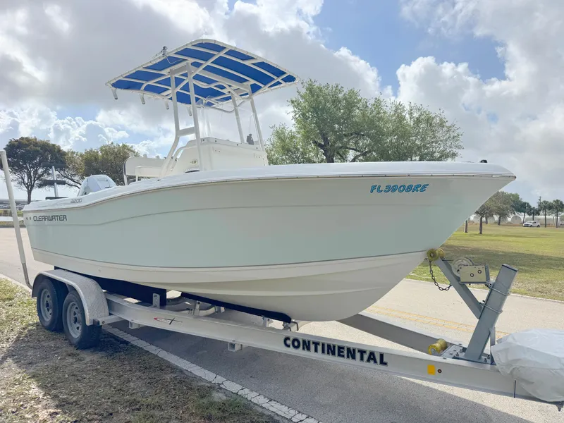 Slide: The Image of 2016 Clearwater 2200 WI Center Console boat on trailer under cloudy sky. - 6