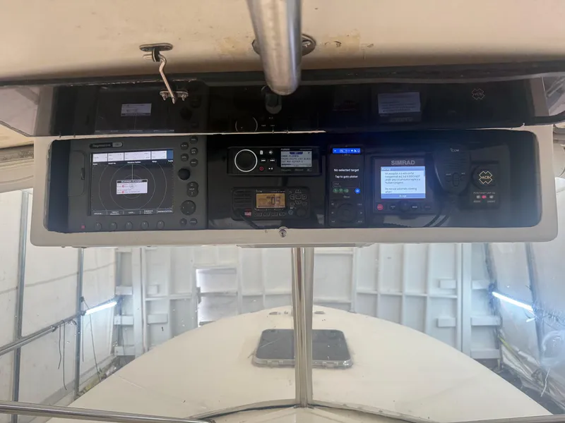 Slide: The Image of Control panel of a 1990 Albemarle 247 Express boat with electronic displays and controls. - 20