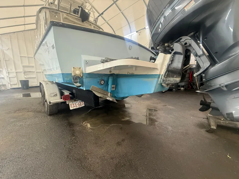 Slide: The Image of 1990 Albemarle 247 Express boat on trailer in covered storage area. - 6