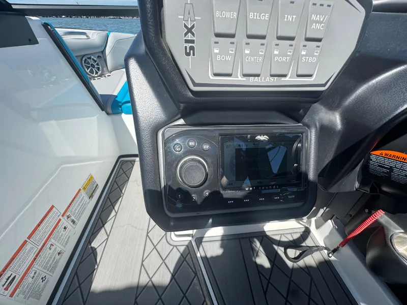 Slide: The Image of Control panel of a 2018 Axis T23 boat, featuring navigation and ballast controls. - 13