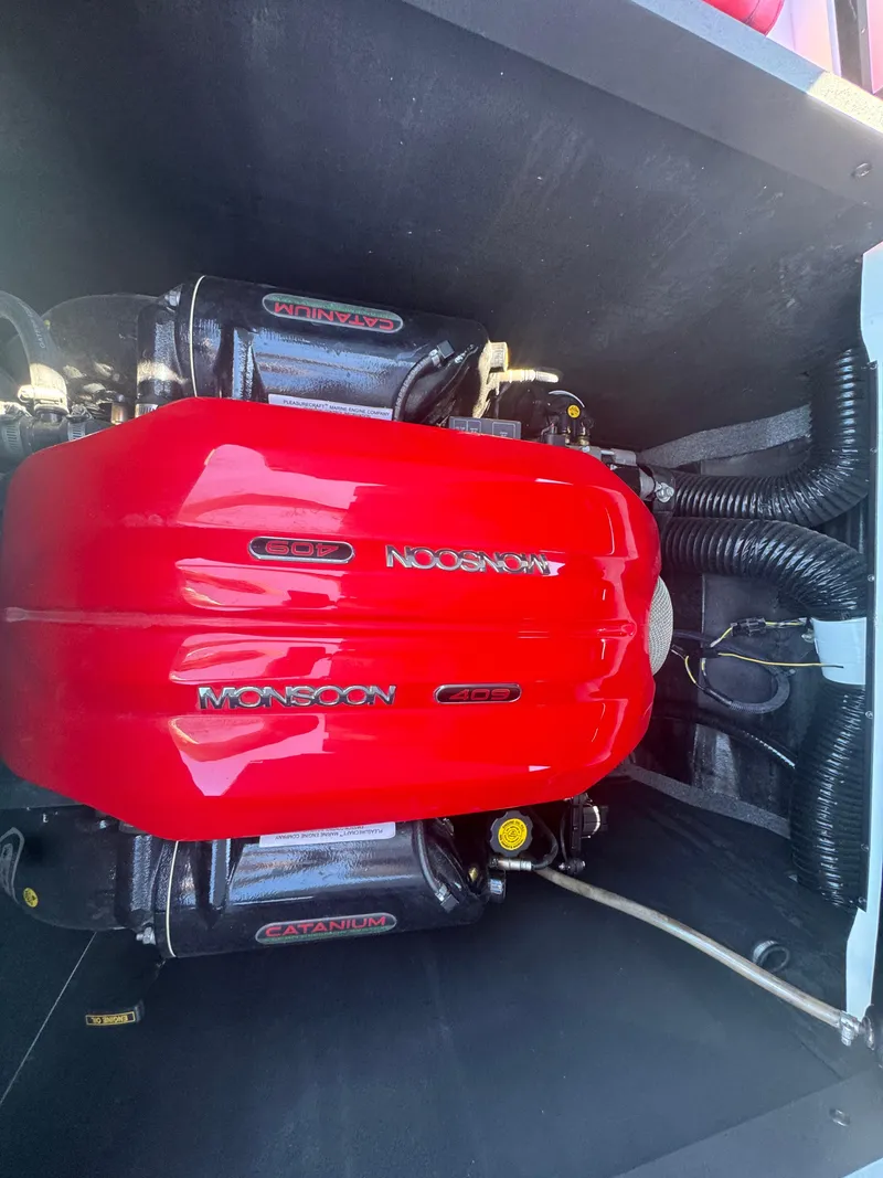 Slide: The Image of 2018 Axis T23 boat engine with red Monsoon cover. - 26