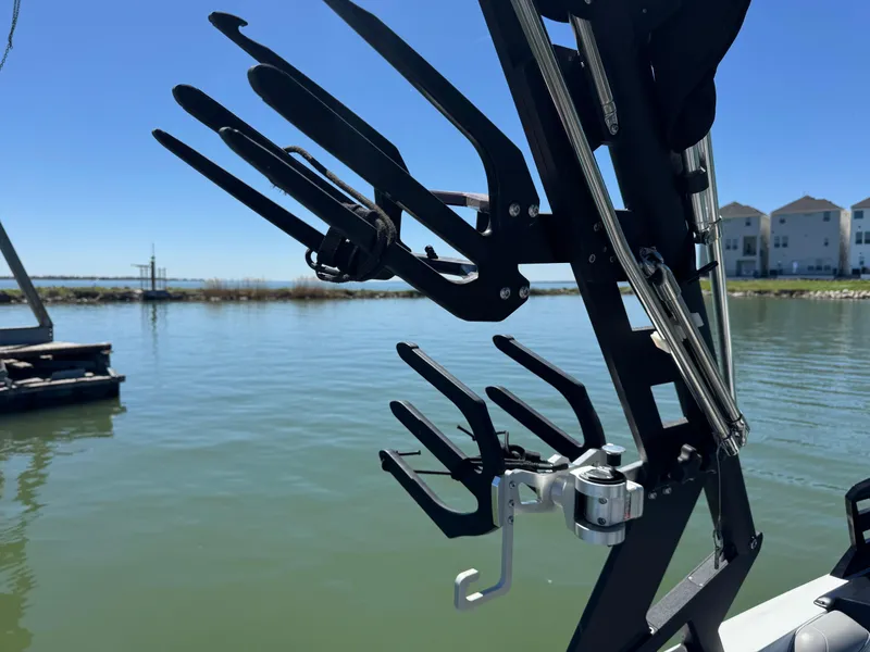 Slide: The Image of Wakeboard rack on 2018 Axis T23 boat by a lake. - 29