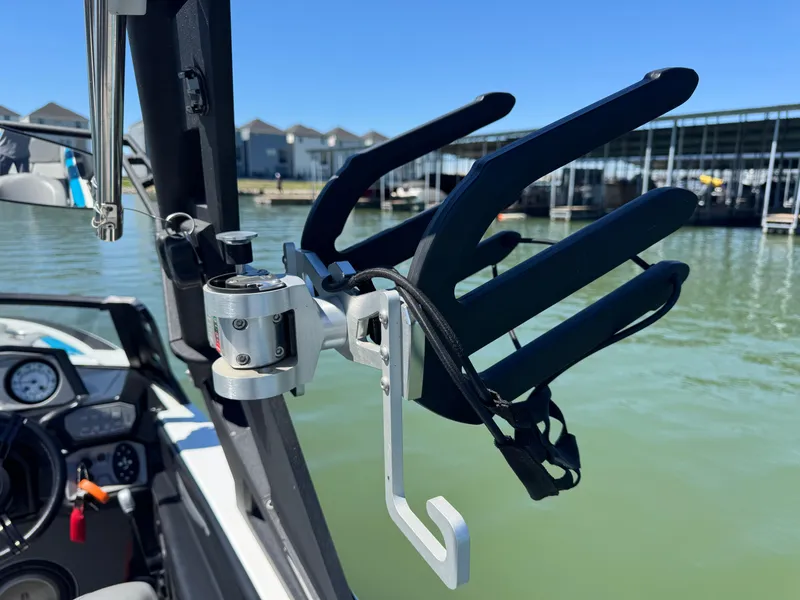 Slide: The Image of 2018 Axis T23 boat with wakeboard rack on calm water. - 30