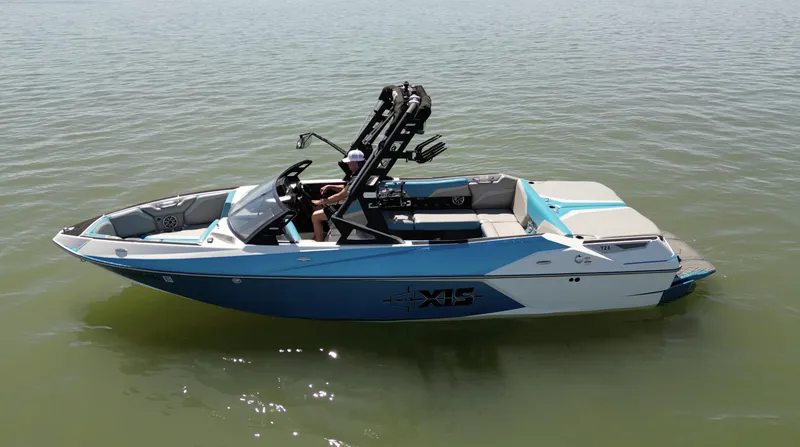 Slide: The Image of 2018 Axis T23 boat on calm water, featuring sleek design and modern features. - 5