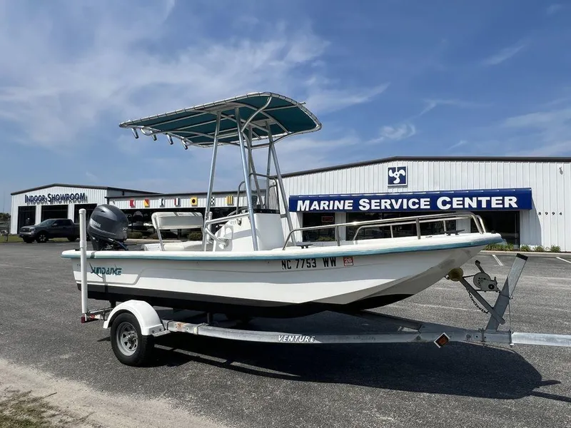 Slide: The Image of 2004 Sundance F17 boat on trailer at Marine Service Center. - 5