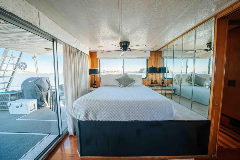 Slide: The Image of 1989 Sumerset houseboat bedroom with mirrored walls and lake view. - 16