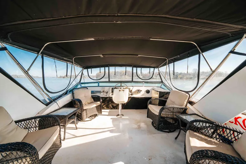 Slide: The Image of 1989 Sumerset houseboat interior with wicker seating and panoramic windows. - 29
