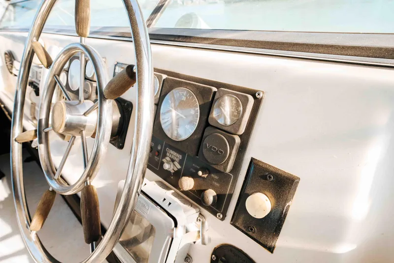 Slide: The Image of 1989 Sumerset houseboat steering wheel and control panel close-up. - 36