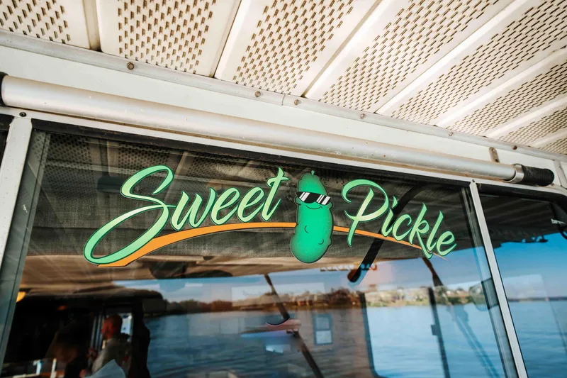 Slide: The Image of 1989 Sumerset houseboat with "Sweet Pickle" decal on window. - 44