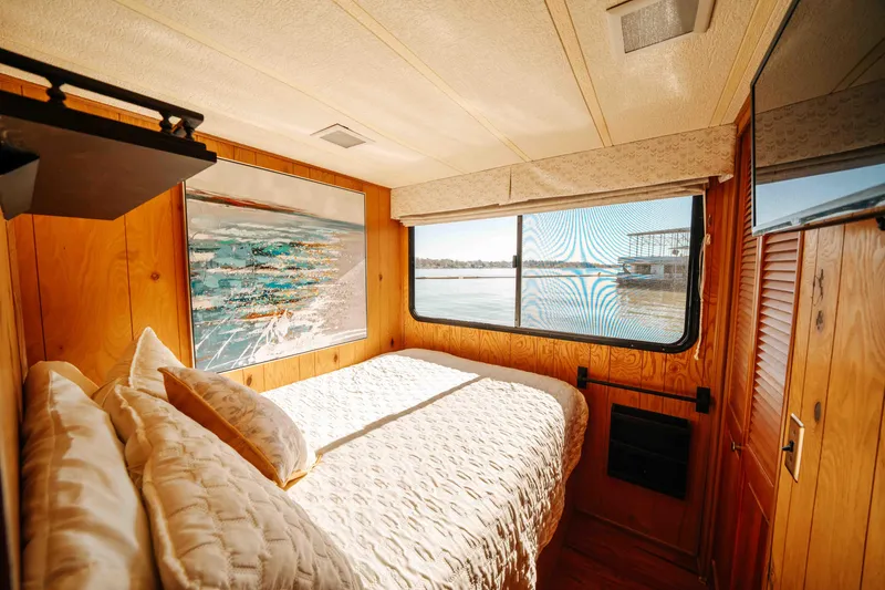 Slide: The Image of Cozy bedroom in 1989 Sumerset houseboat with lake view and wooden interior. - 45