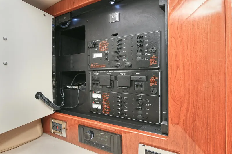 Slide: The Image of Electrical panel inside 2010 Formula 350 SS boat, featuring control switches and wiring. - 16