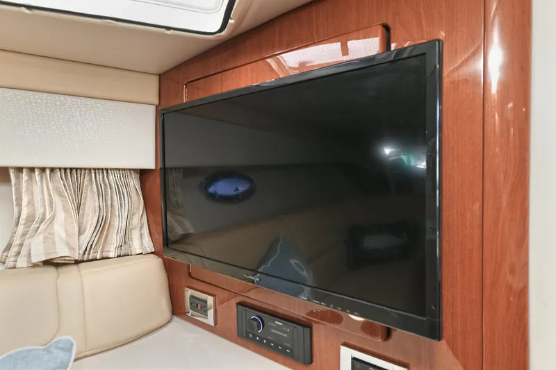 Slide: The Image of Flat-screen TV in 2010 Formula 350 SS boat cabin with wood paneling. - 17