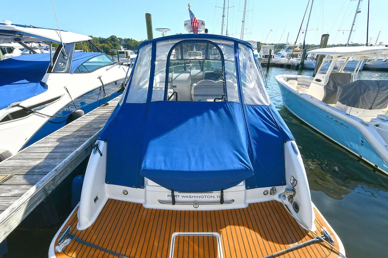 Slide: The Image of 2010 Formula 330 SS Super Sport boat docked with blue cover. - 2