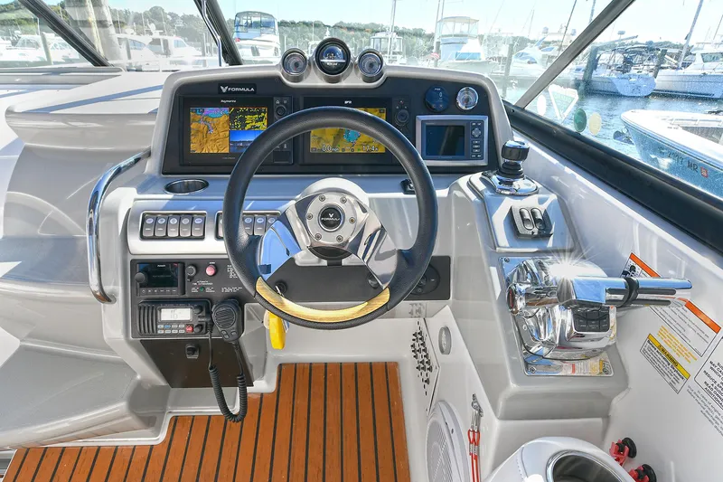 Slide: The Image of Cockpit of a 2010 Formula 350 SS boat with modern navigation equipment. - 21