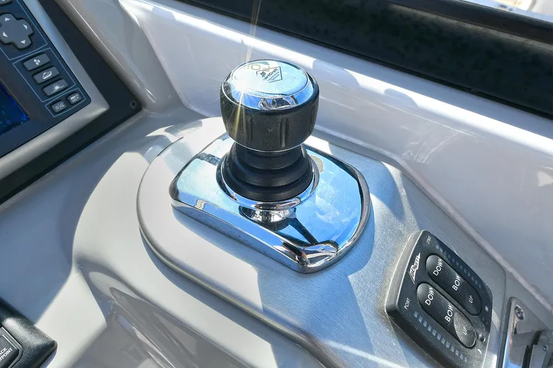 Slide: The Image of Joystick control on 2010 Formula 350 SS boat dashboard, featuring sleek chrome finish. - 22